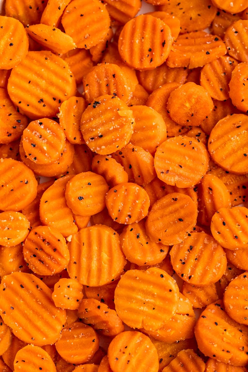 Close up view of cooked, sliced carrots.
