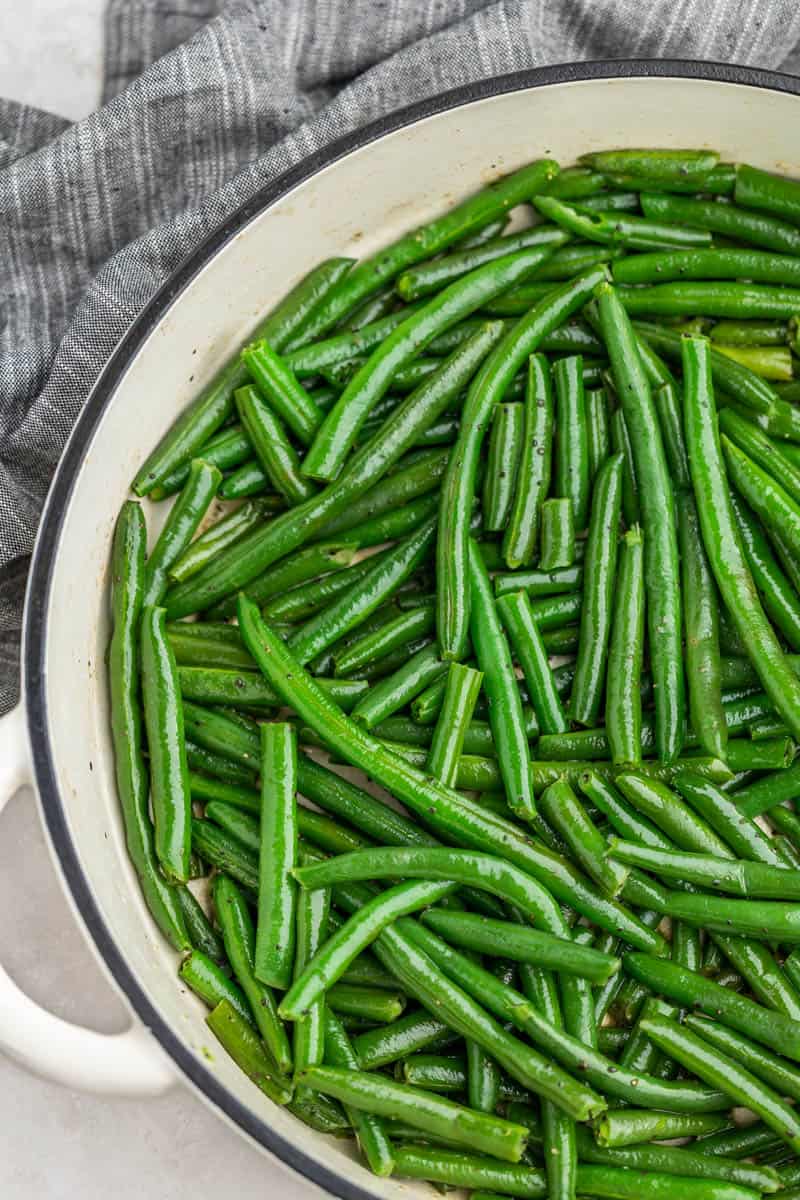 Overhead view of green beans in a skillet.
