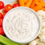 Homemade ranch dip in a white serving bowl.