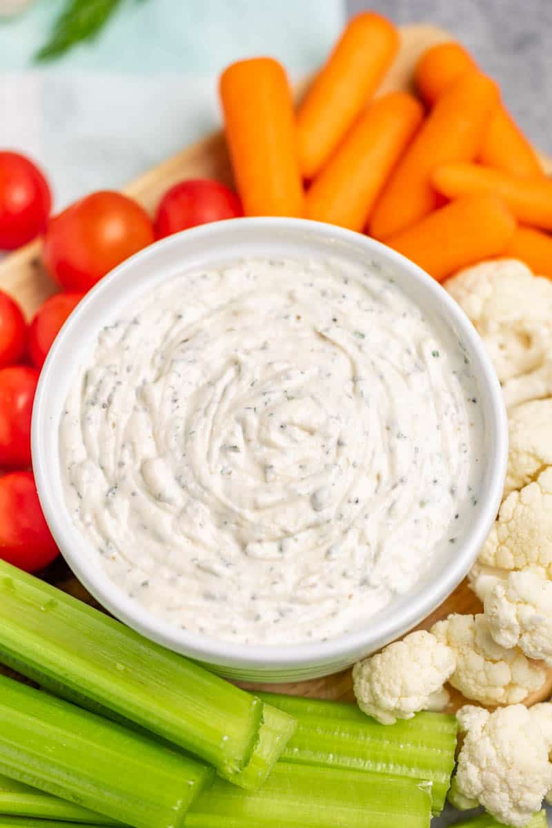 Homemade ranch dip in a white serving bowl.