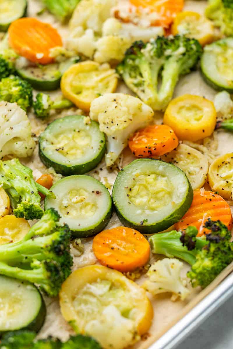 Close up of mixed Normandy vegetables on a baking sheet.