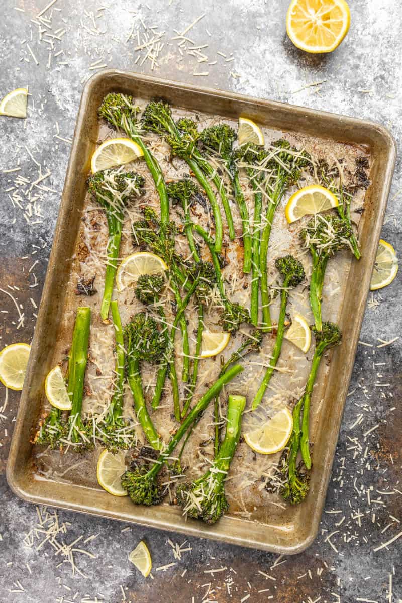 Overhead view of broccolini on a baking sheet.