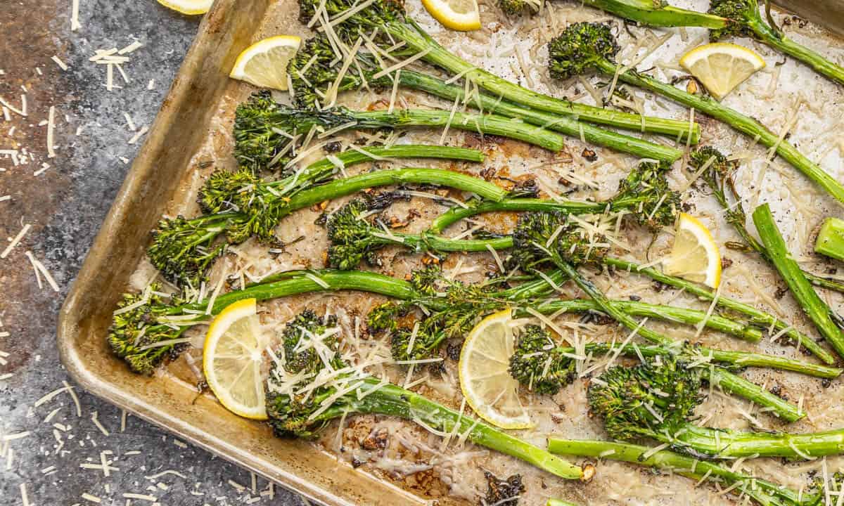 Pan roasted broccolini on a baking sheet.