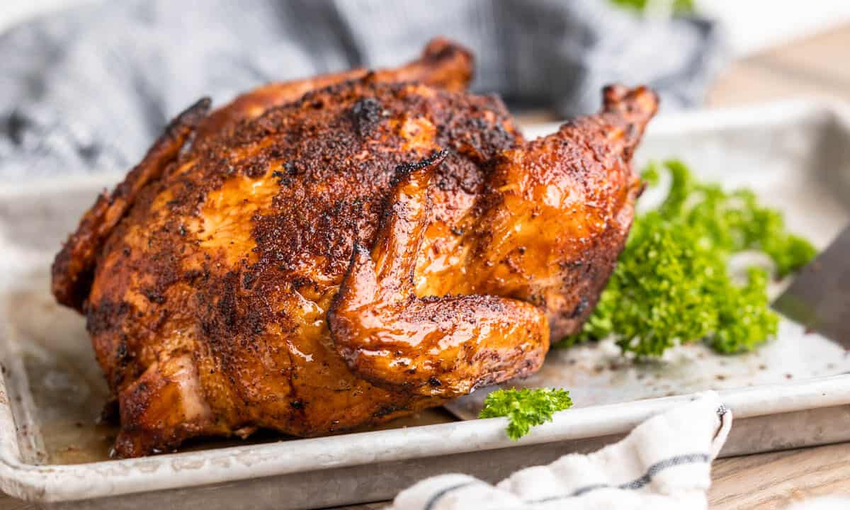 Close up view of a smoked chicken.