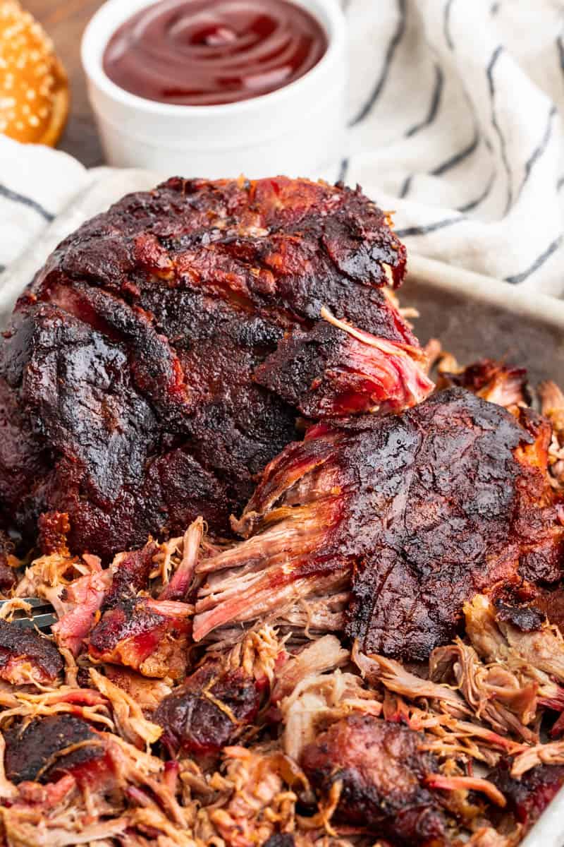 Smoked pork butt on a baking sheet.