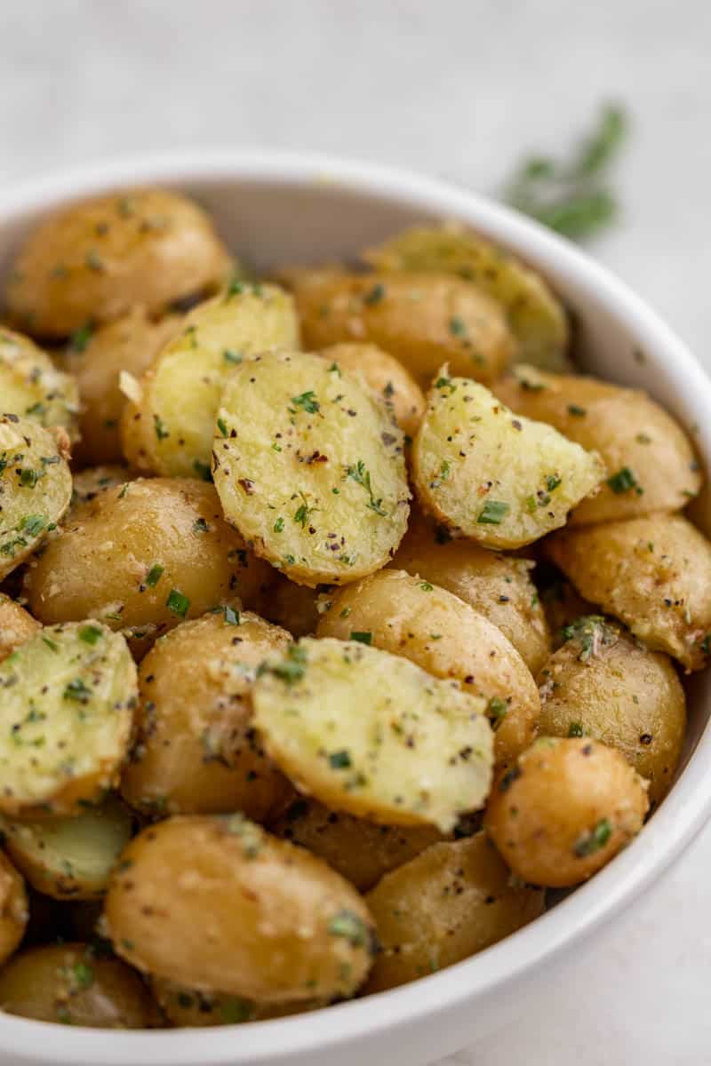 Close up view of boiled potatoes in a bowl.
