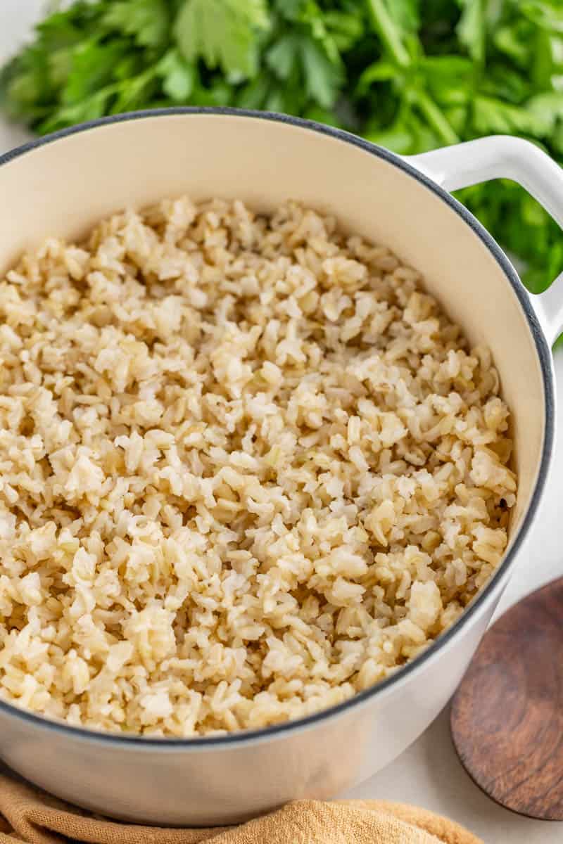 A large saucepan filled with brown rice.