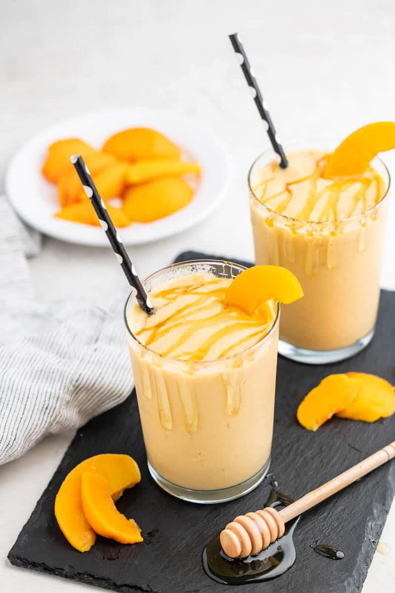 Two glasses of peach smoothie.