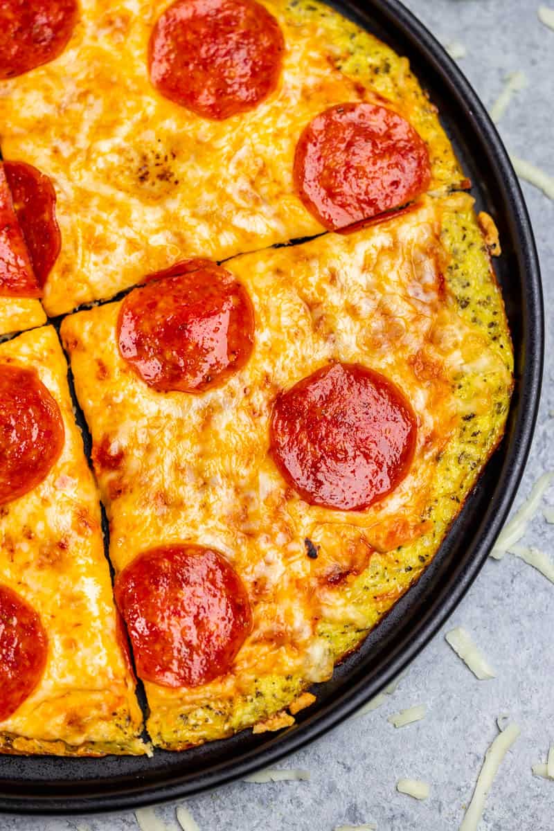 Overhead view of a pizza made with a cauliflower crust.