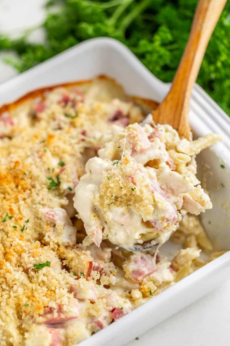 Chicken cordon bleu casserole in a white baking dish.