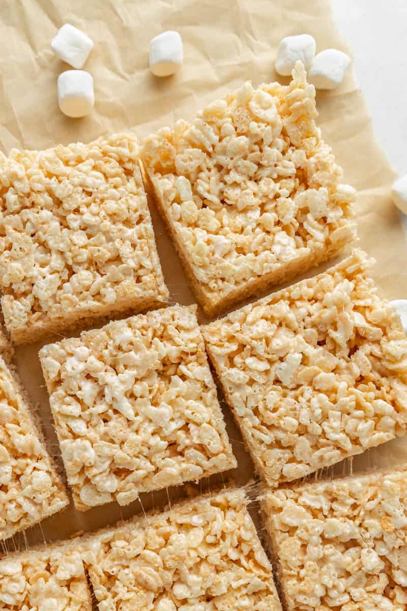 Overhead view of Rice Krispie treats on parchment paper.