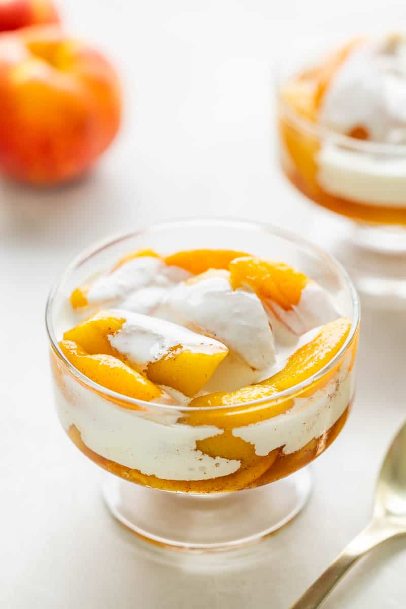 Peaches and cream dessert in a small dish.