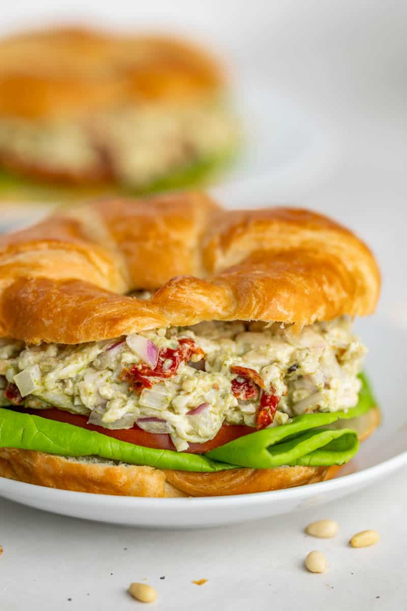 A croissant with pesto chicken salad.