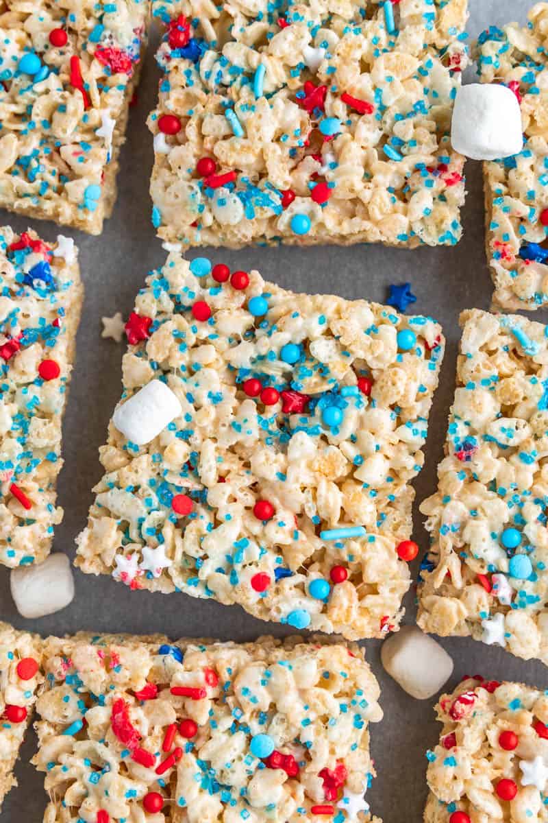 Overhead view of homemade Rice Krispie treats with red, white, and blue sprinkles.