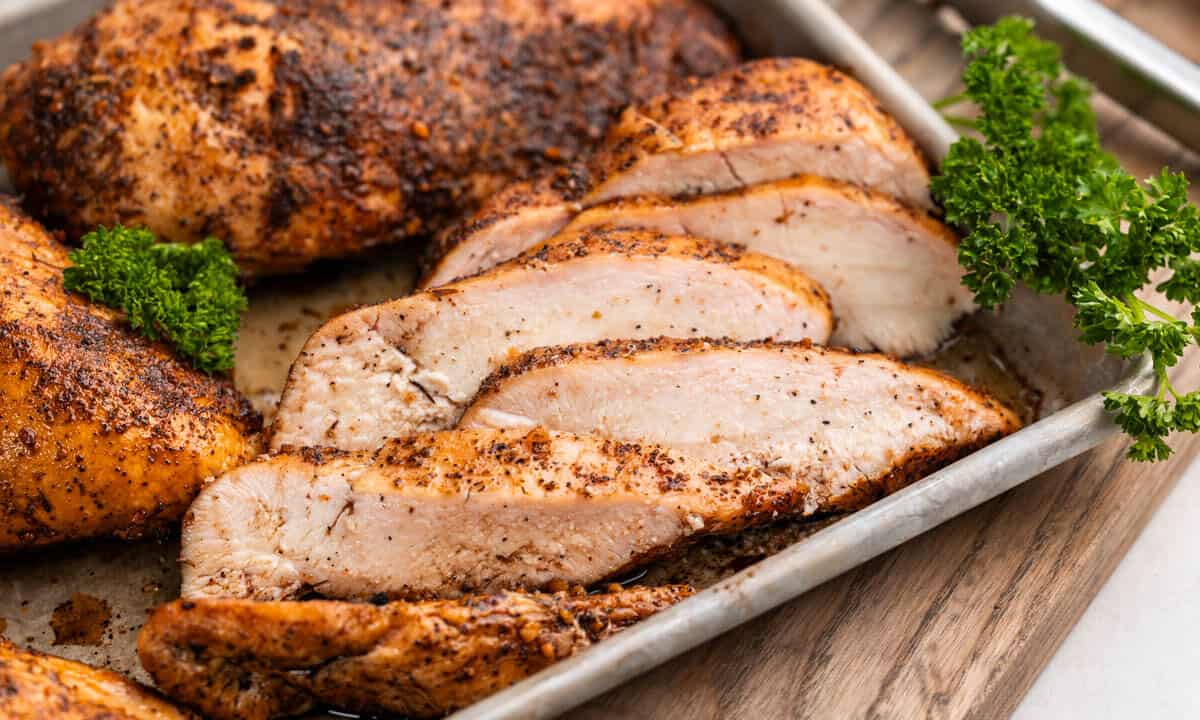 Close up view of smoked, sliced chicken breasts.