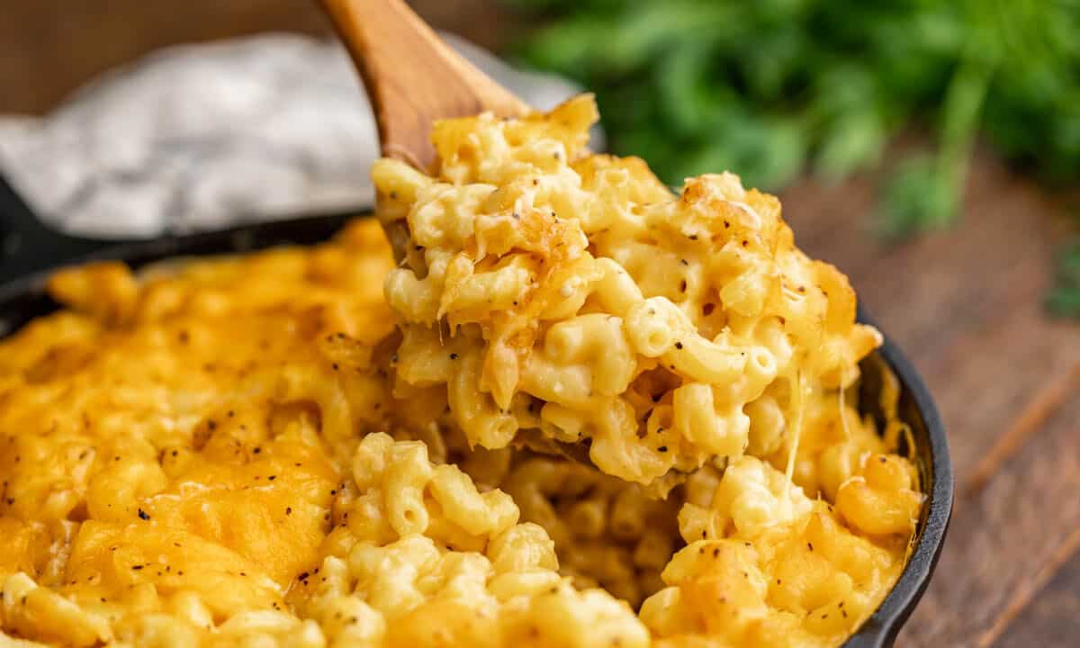 Close up view of smoked Mac and cheese in a cast iron skillet.