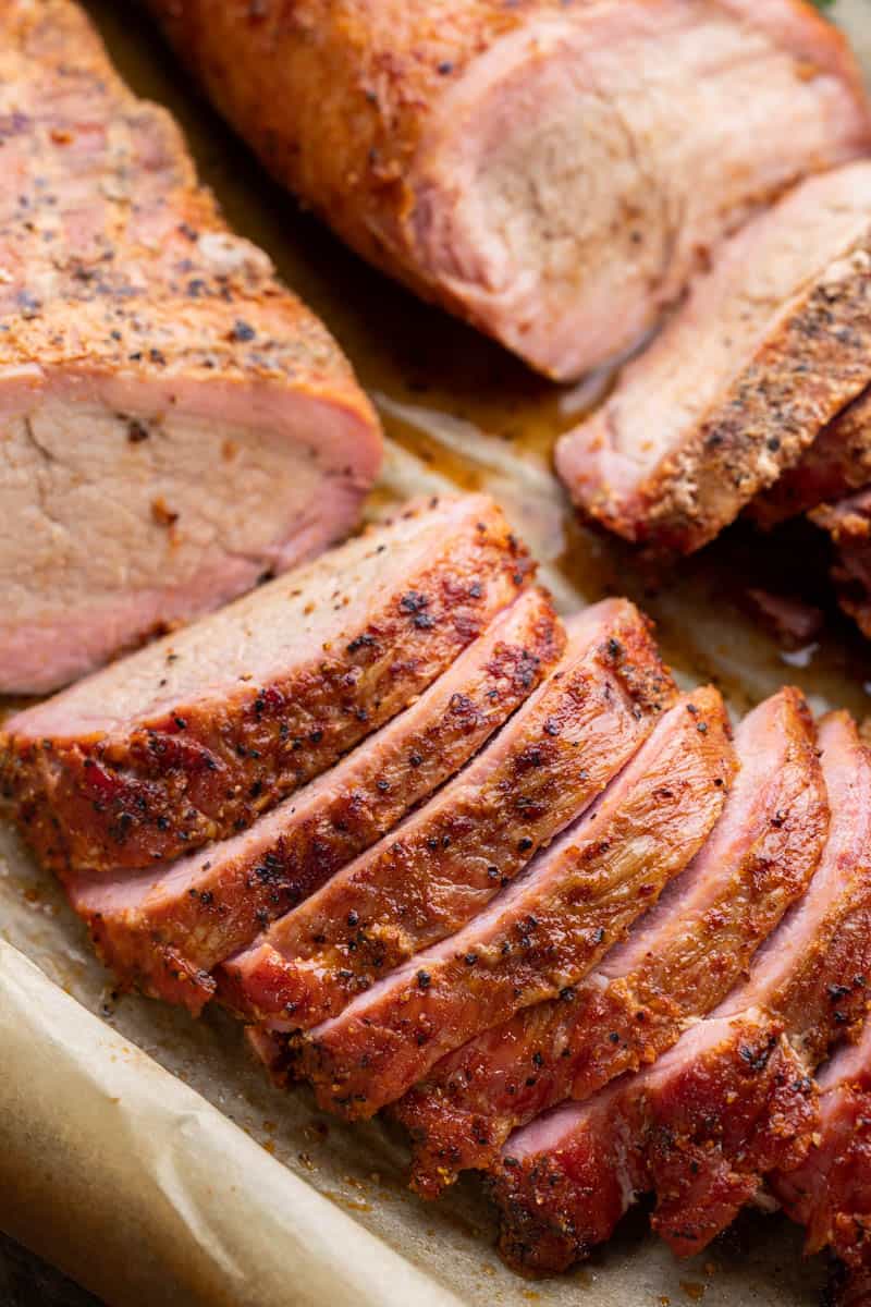Overhead view of smoked tenderloin cut into slices.