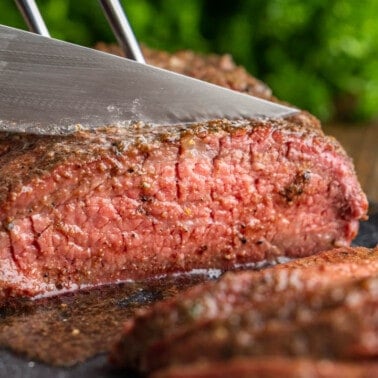 Tri tip being cut with a sharp knife.