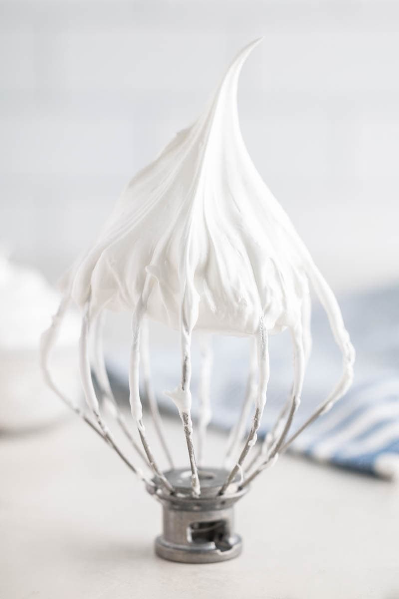 Homemade marshmallow fluff on a stand mixer whisk attachment.