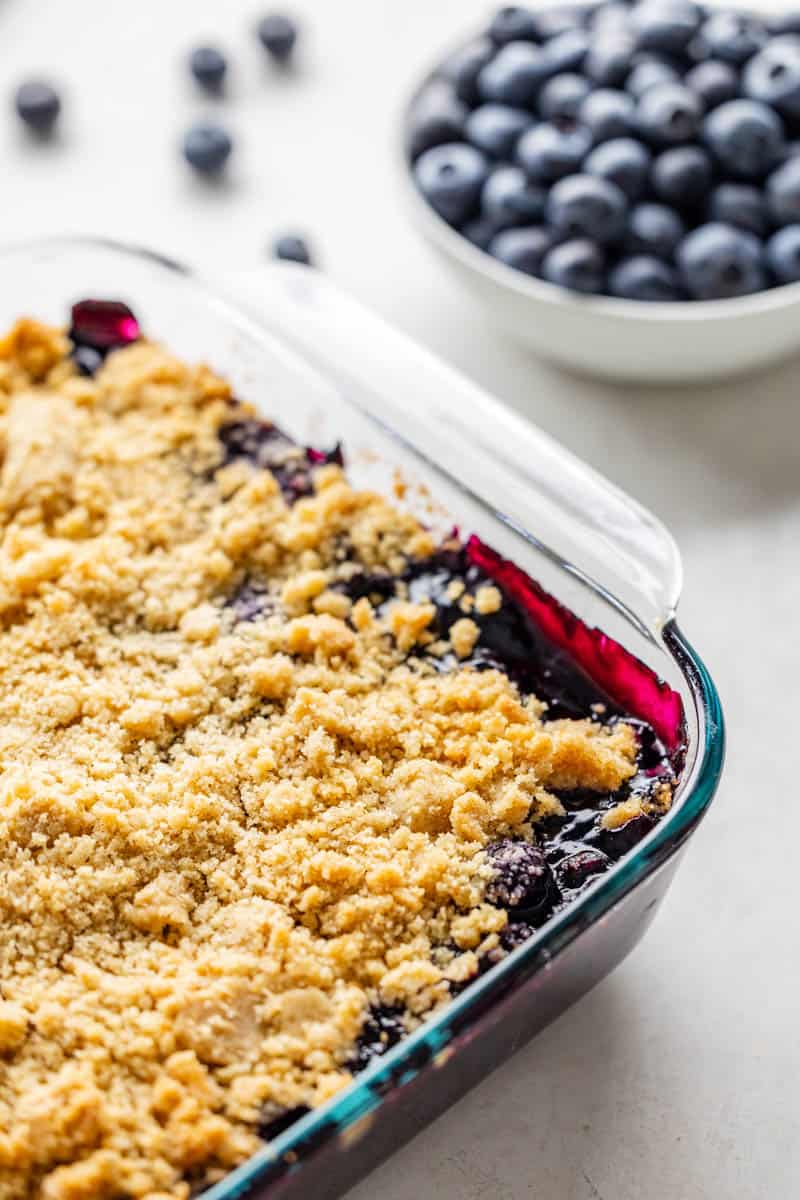 A 9x13 pan filled with blueberry crumble dessert.