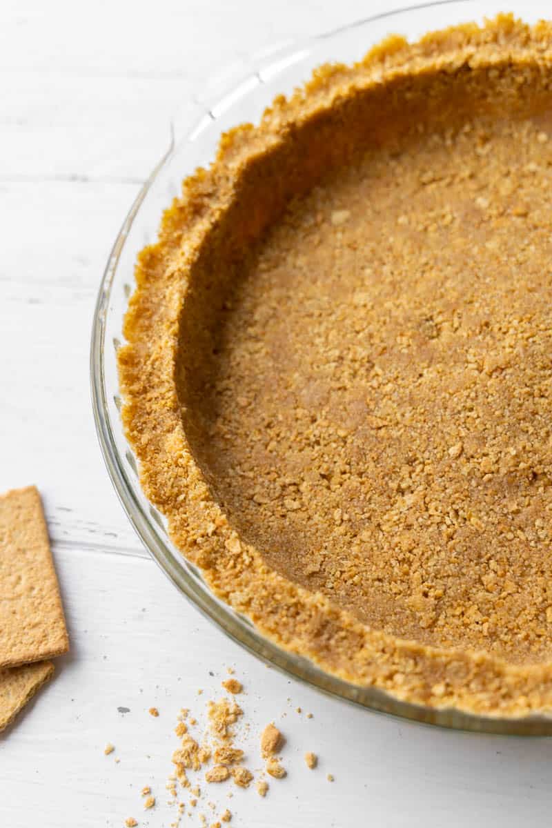 Overhead view of a graham cracker crust.