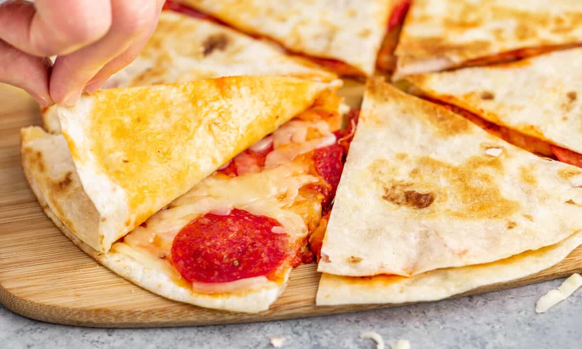 Close up view inside a pizza quesadilla.