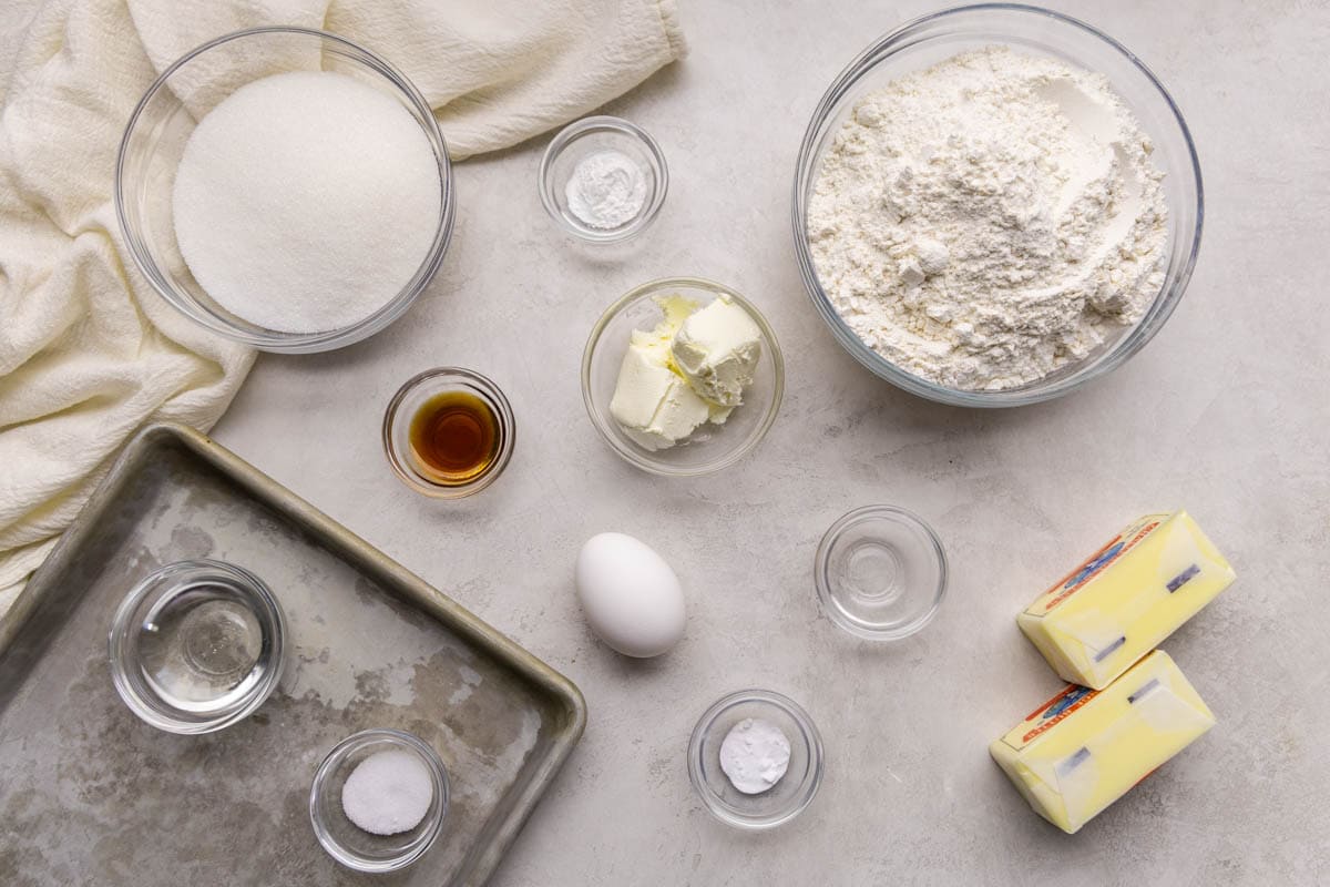 Raw ingredients spread out on a counter to make drop-style sugar cookies.