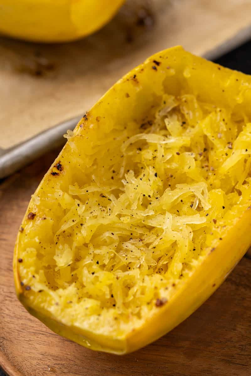 Close up view of a half of a spaghetti squash, cooked.