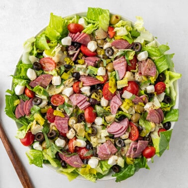 Overhead view of an antipasto salad in a serving bowl.