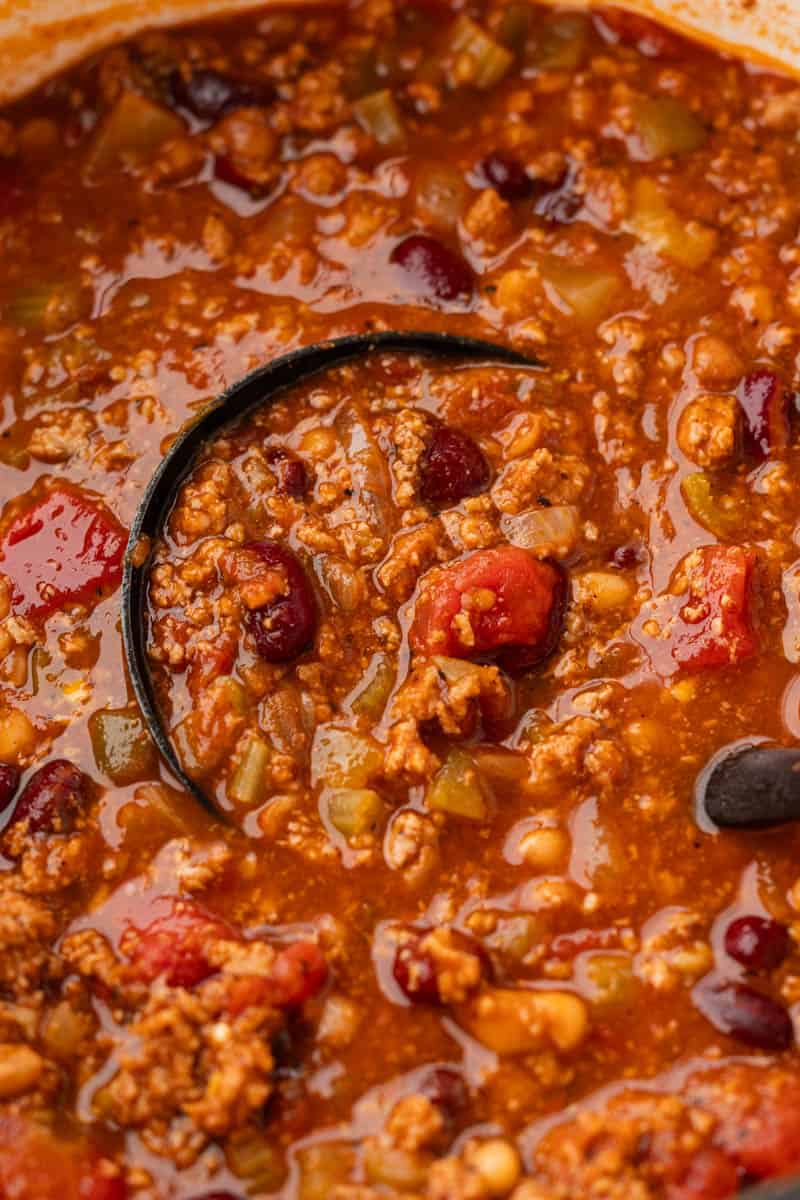 Close up view of turkey chili in a large pot.