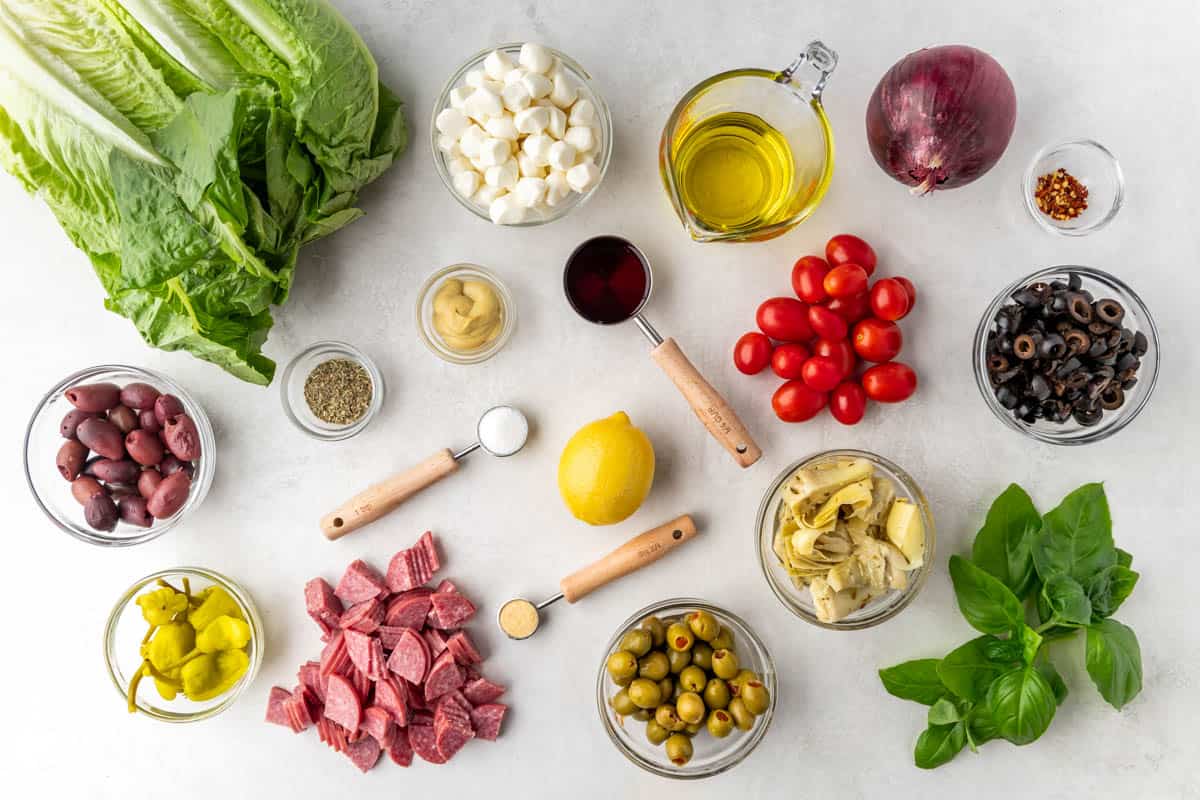 Overhead view of the raw ingredients needed to make an antipasto salad.