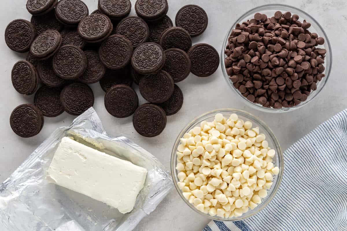 Overhead view of the raw ingredients needed to make Oreo truffles on a clean counter.
