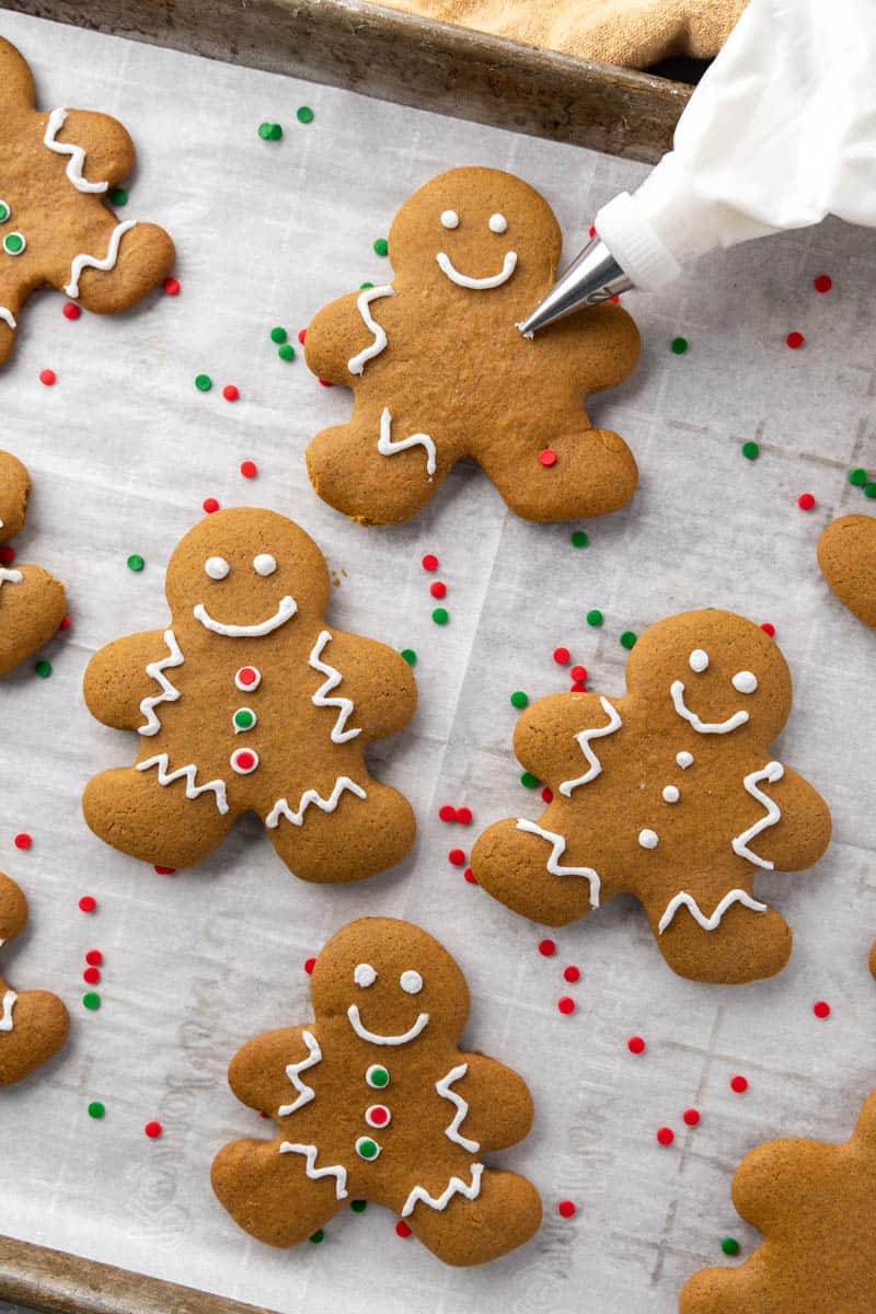 Gingerbread man cookie on a baking sheet.