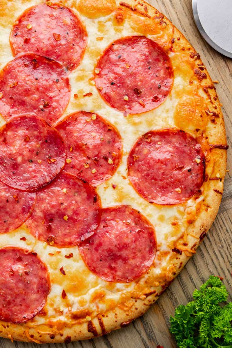 Top view of a whole salami pizza.