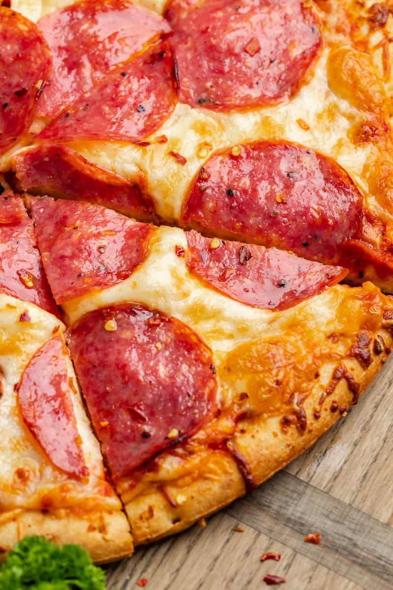 Overhead, close up view of a salmi pizza.