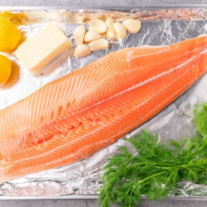 An overhead view of the raw ingredients needed to make baked salmon.