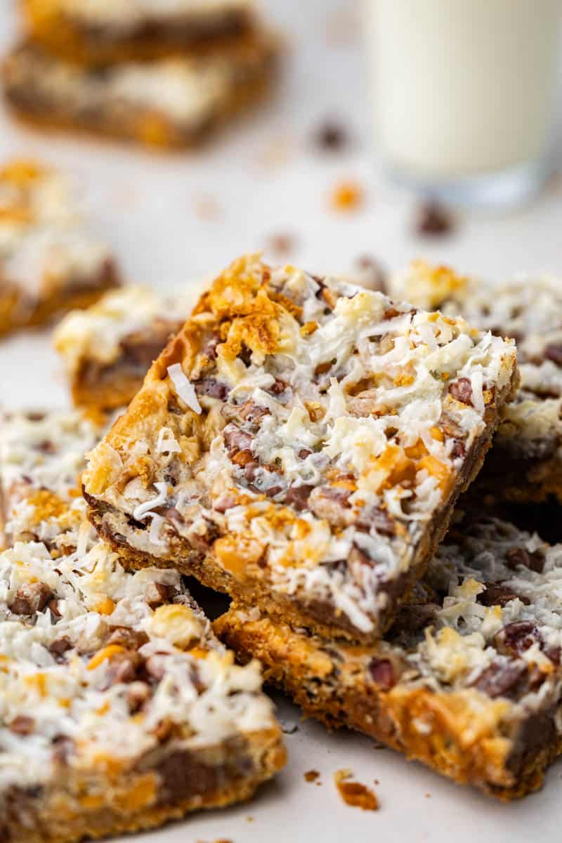 Close up view of 7 layer bars piled on top of each other.