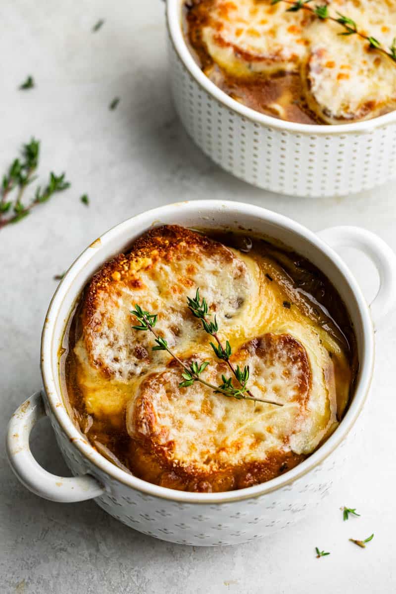 French onion soup in a small white bowl.