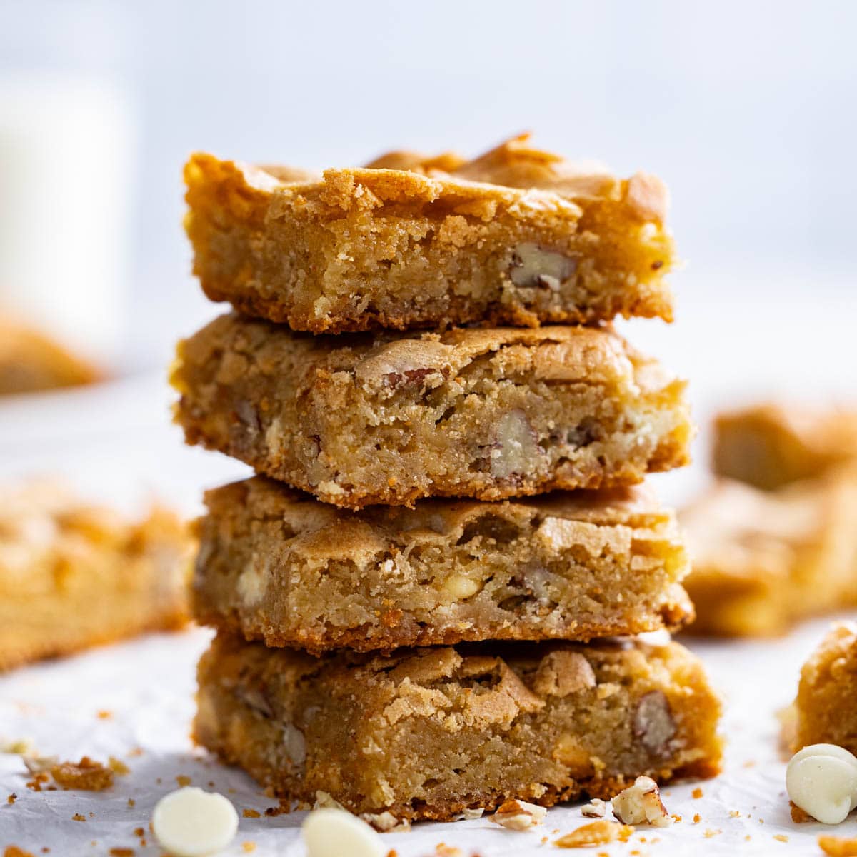 A close up view of a stack of squares of browned butter blondies.