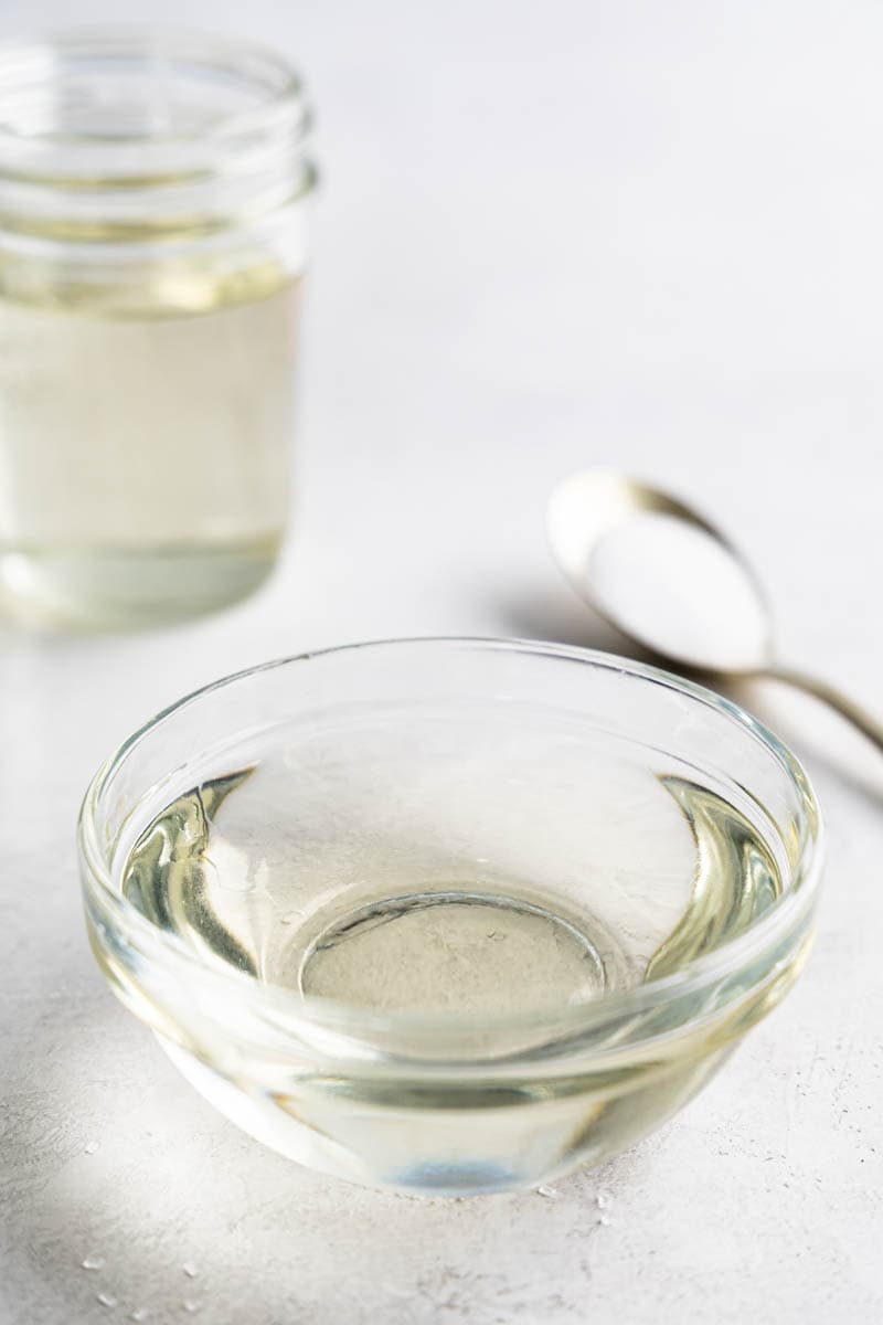 A small glass bowl with simple syrup.