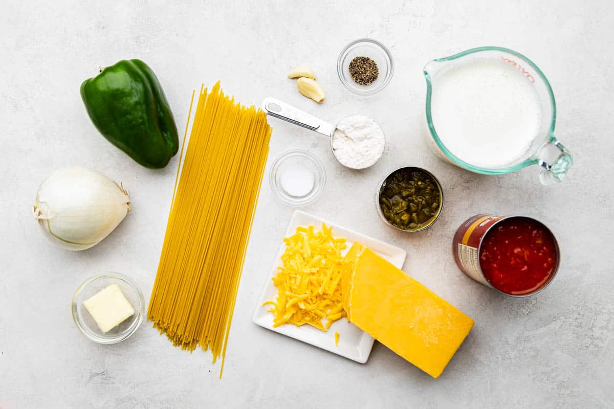 An overhead view of the ingredients needed to make chicken spaghetti. 