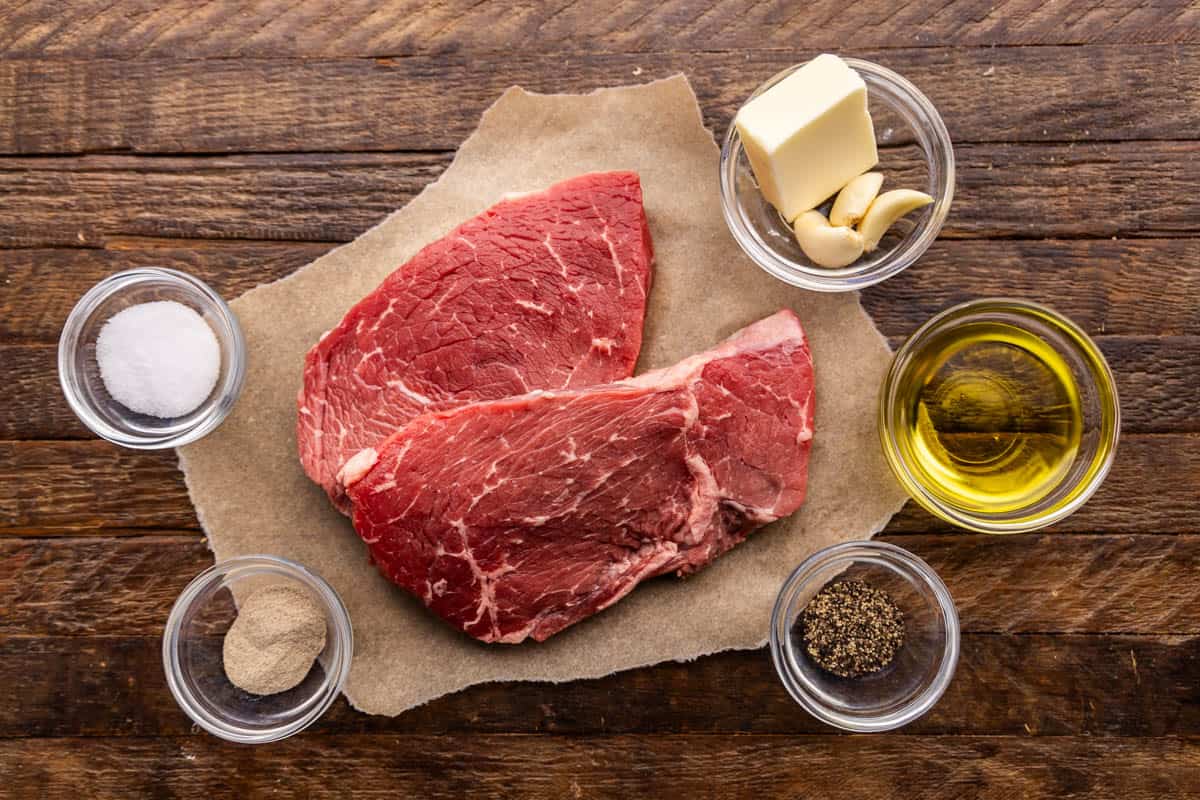 An overhead shot of the ingredients needed to make a sirloin steak.