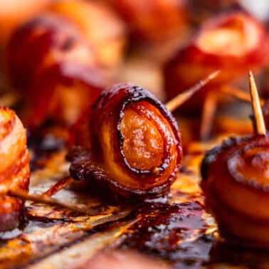 A close up view of bacon wrapped water chestnuts.