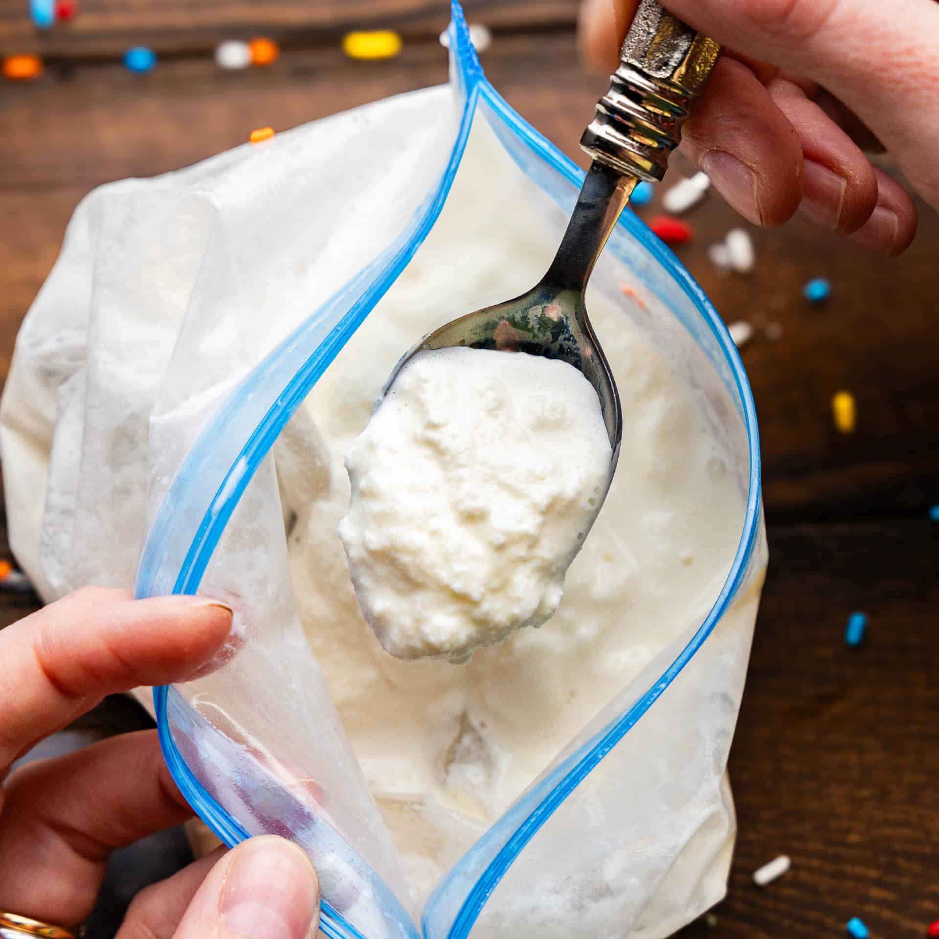 A bag with the ice cream inside of it with a spoon.
