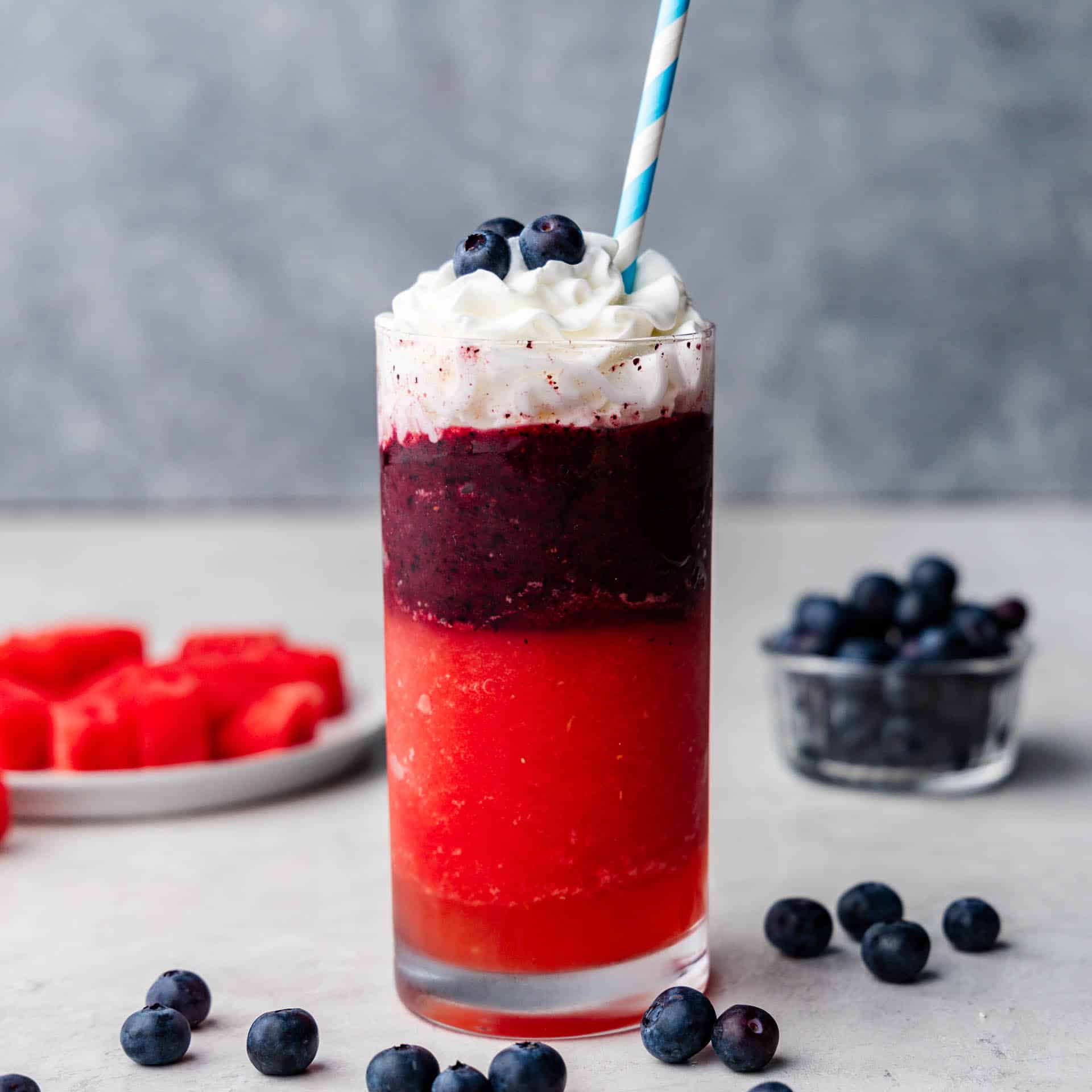 A Red, White, and Blue Slushy with watermelon and blueberries.