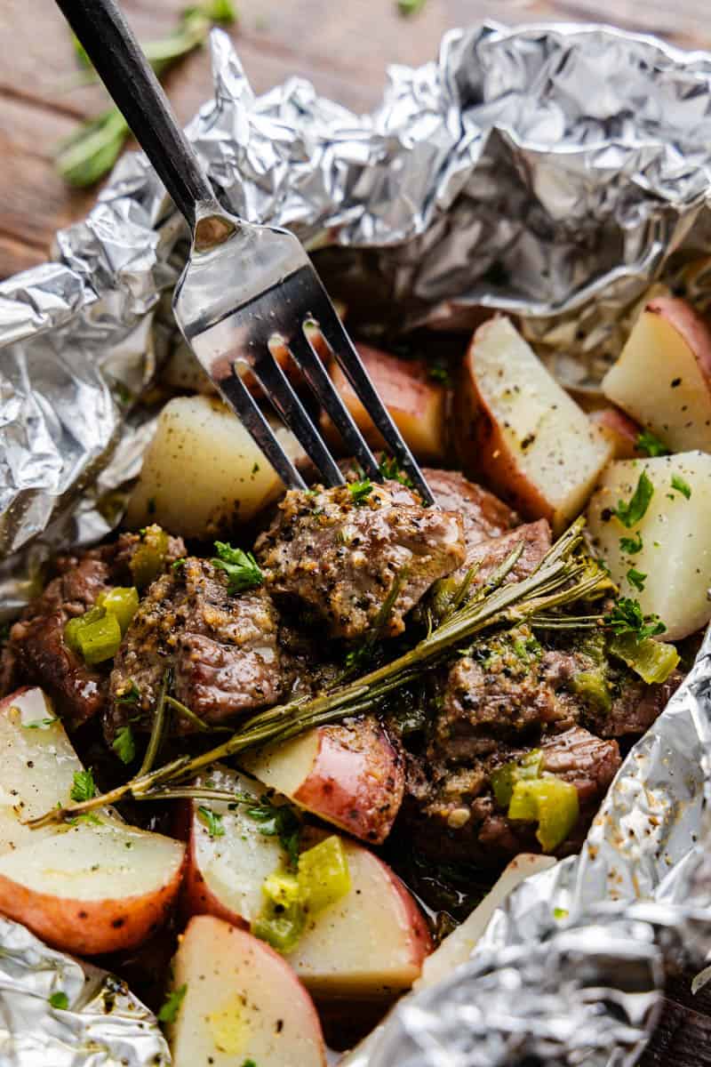 A delicious foil packet of steak and potatoes. 