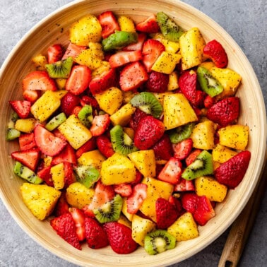 An overhead view of a bowl of summer fruit salad.
