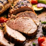 A cascade of juicy slices of grilled pork tenderloin.