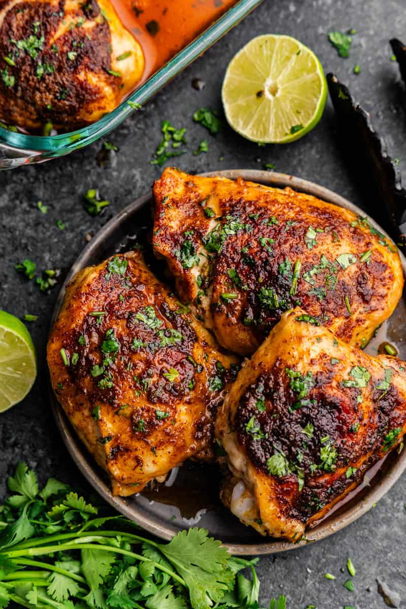 An overhead view of a plate of mexican-spiced chicken thighs.