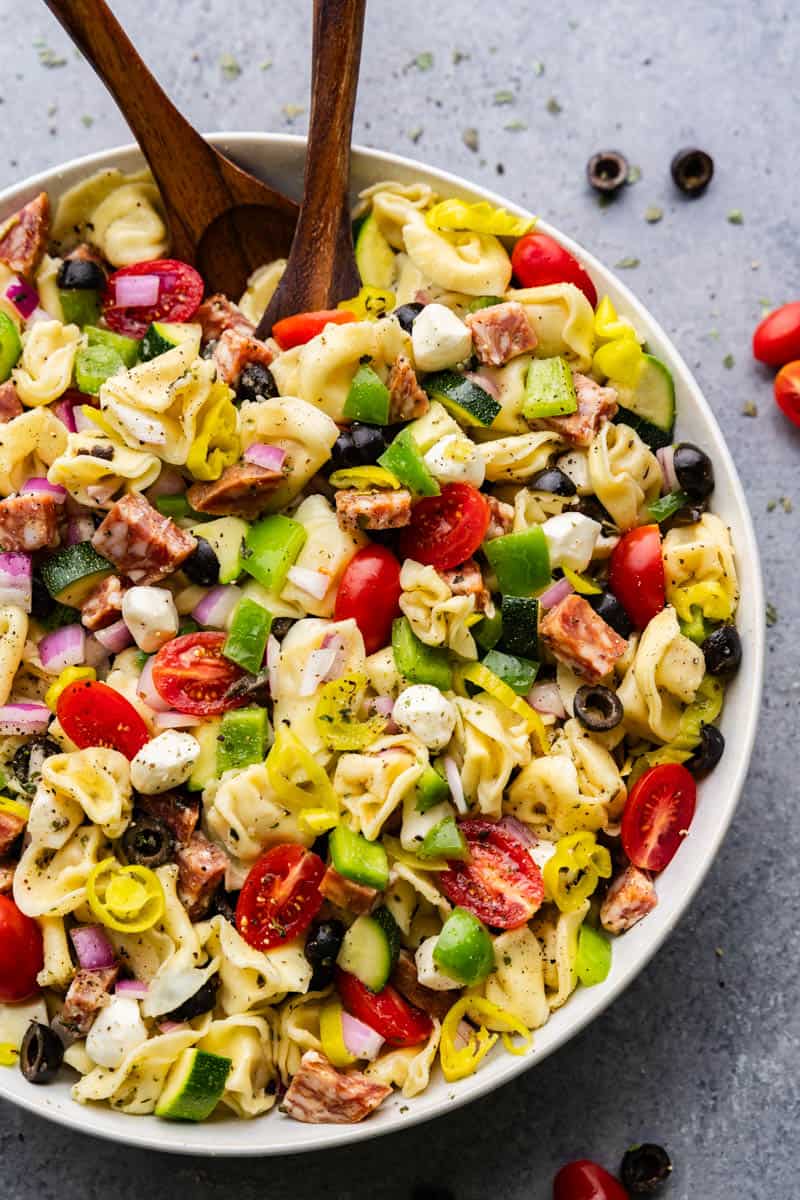 A large bowl of pasta salad showing its delicious combination of ingredients.